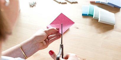 With one Post-it® Note at a time, cut from each corner toward the center